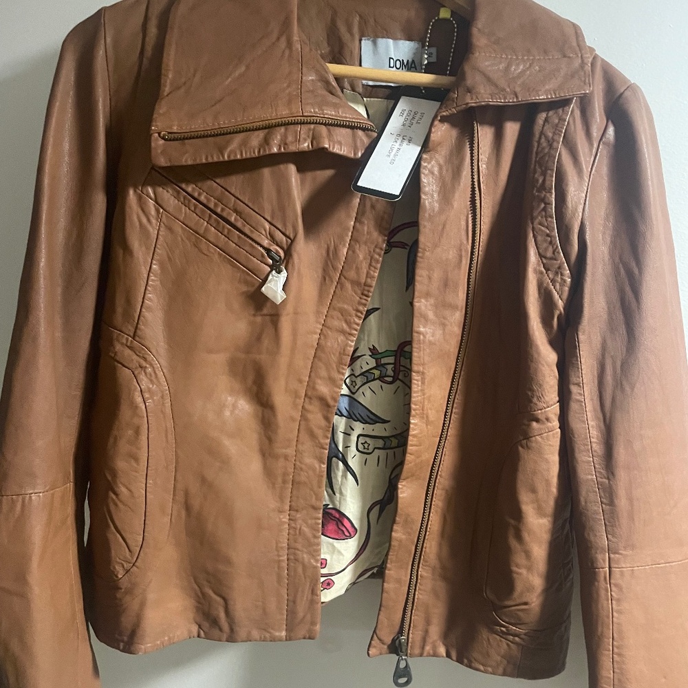 Brand new, 100% authentic Doma leather jacket .